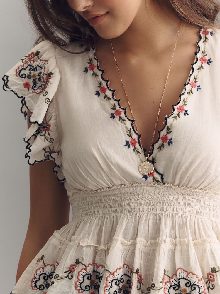 Anthropologie Cream Embroidered Flutter-Sleeve Top - Image 1 of 3 Anthropologie Cream Embroidered Flutter-Sleeve Top - Image 1 of 3
