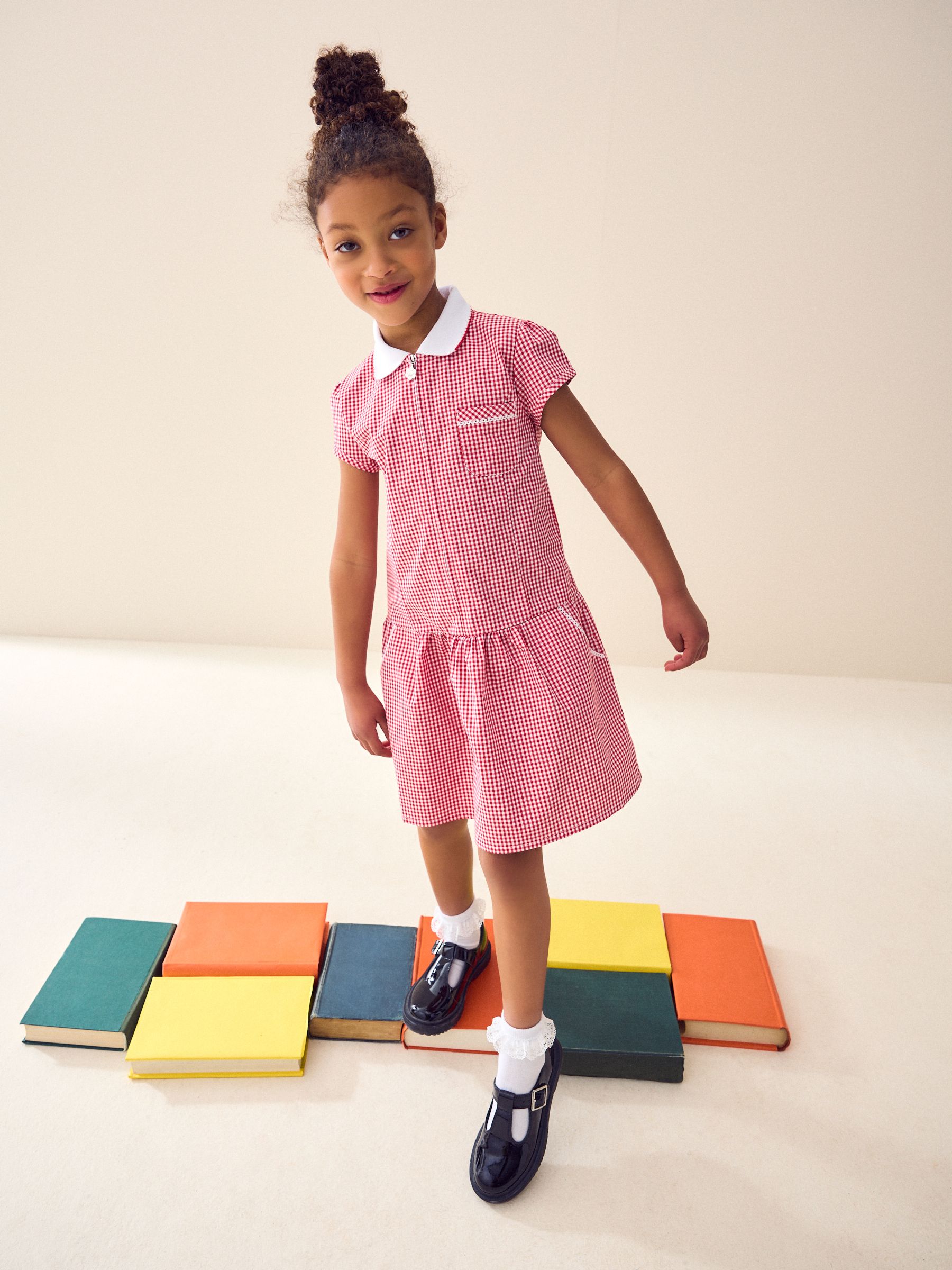 Red and white gingham school dress shop