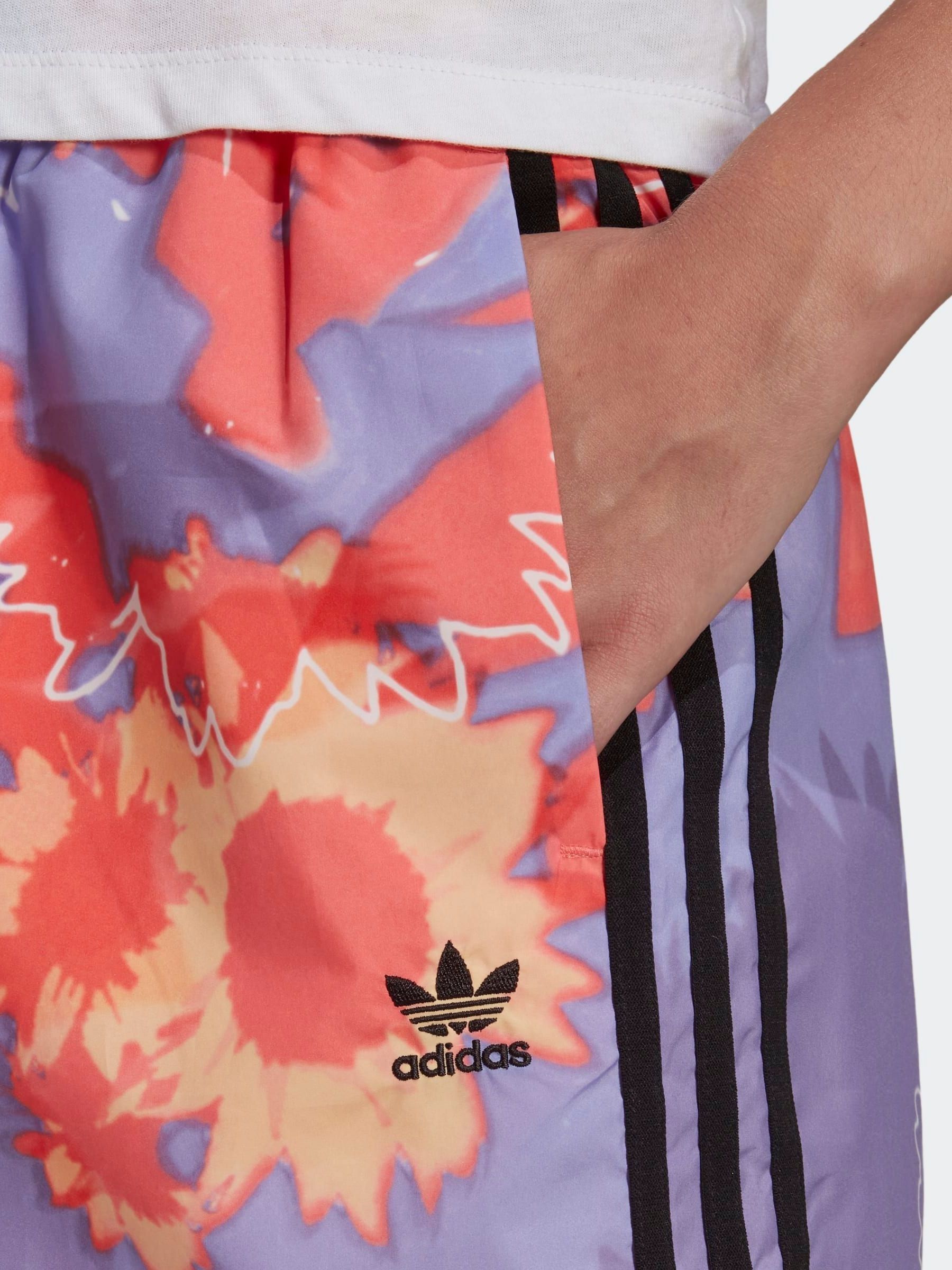purple and orange adidas tracksuit