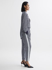 Reiss Navy/White Ezra Polka Dot Drawstring Tapered Trousers - Image 1 of 5