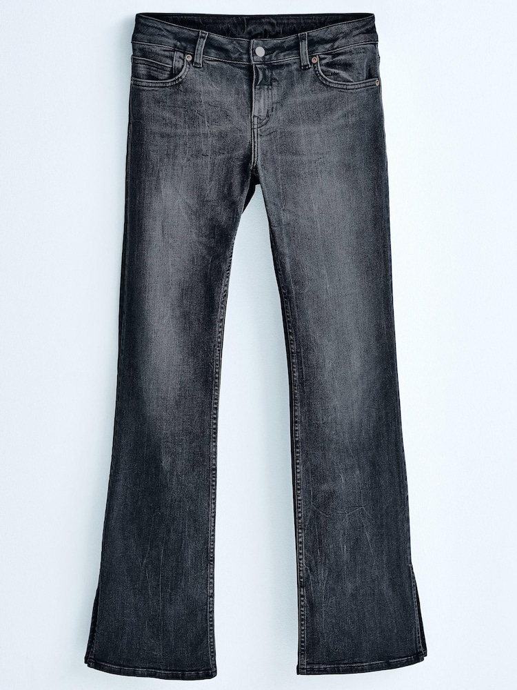 Czarny - Rozkloszowane dżinsy Own. ze stretchem, niskim stanem i rozcięciem z boku - Obraz 1 z 1