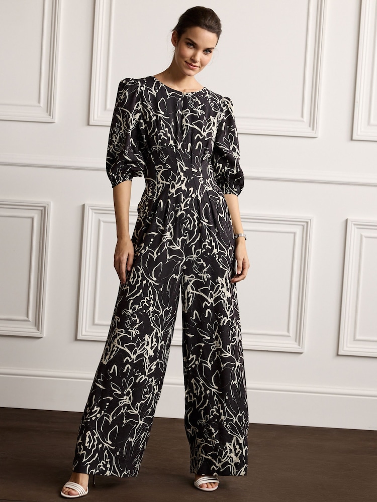 Schwarz/Ecru-Creme - Overall mit abstraktem Print - Bild 1 von 4 Schwarz/Ecru-Creme - Overall mit abstraktem Print - Bild 1 von 4