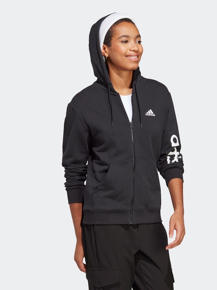 adidas Dark Black Sportswear Essentials Linear Full-Zip French Terry 100% Cotton Hoodie - Image 1 of 7 adidas Dark Black Sportswear Essentials Linear Full-Zip French Terry 100% Cotton Hoodie - Image 1 of 7