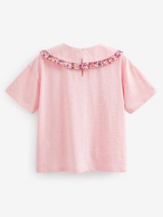 Pink - T-Shirt mit Blumenstickerei am Kragen (3–16 Jahre) - Bild 5 von 5