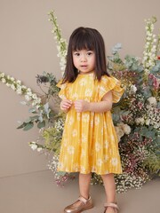 Żółty w stokrotki - Sukienka z błyszczącym nadrukiem (3 mies. –8 lat) - Obraz 2 z 6