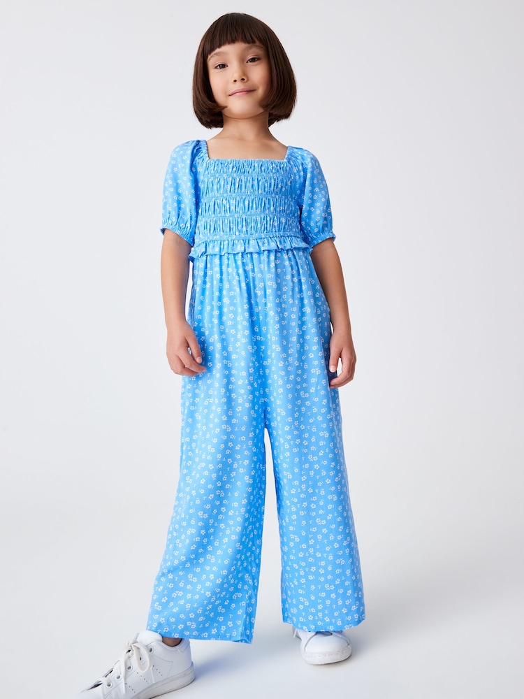 Blau - Kurzärmeliger Jumpsuit mit Blümchenmuster (3–16 J.) - Bild 1 von 6