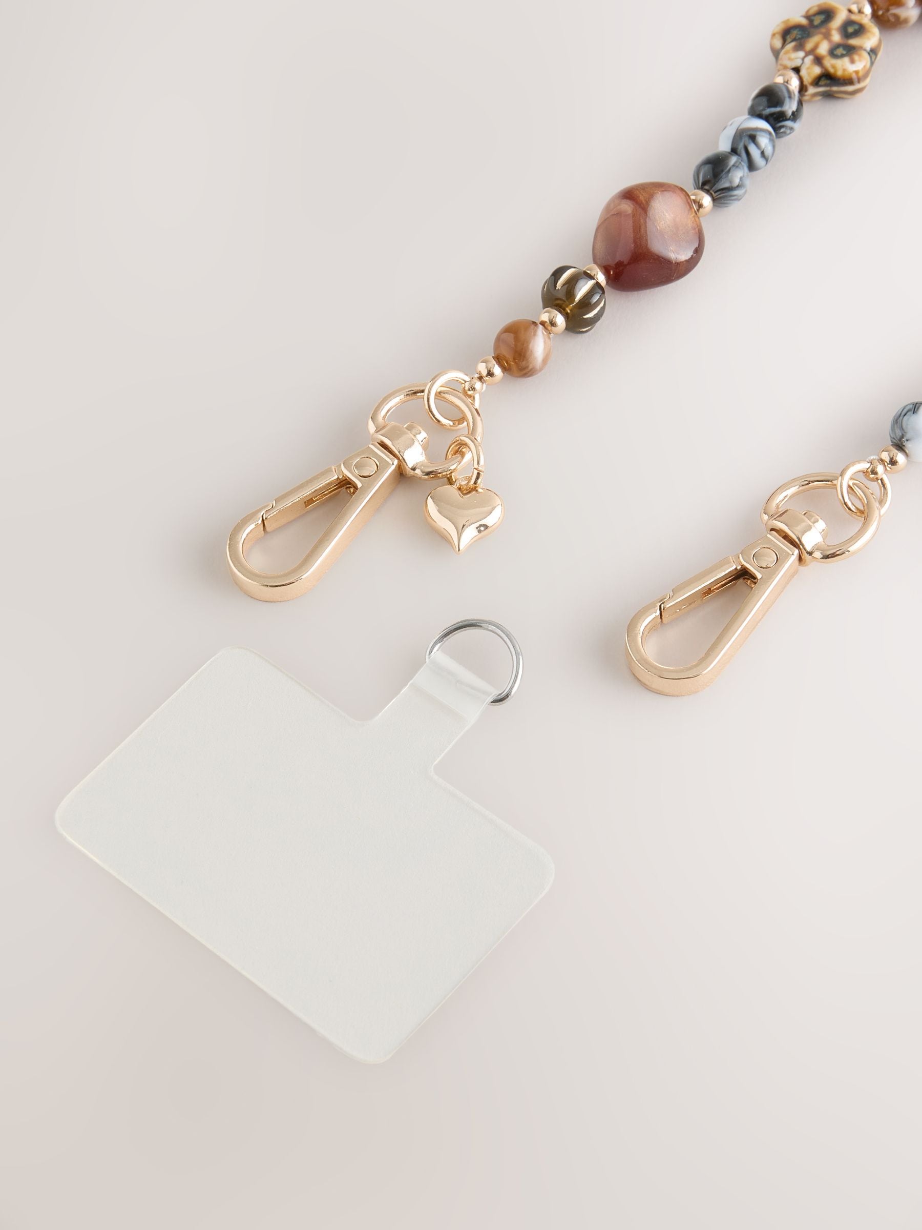 Buy Chocolate Brown Resin Bead Phone Strap Wristlet from the Next
