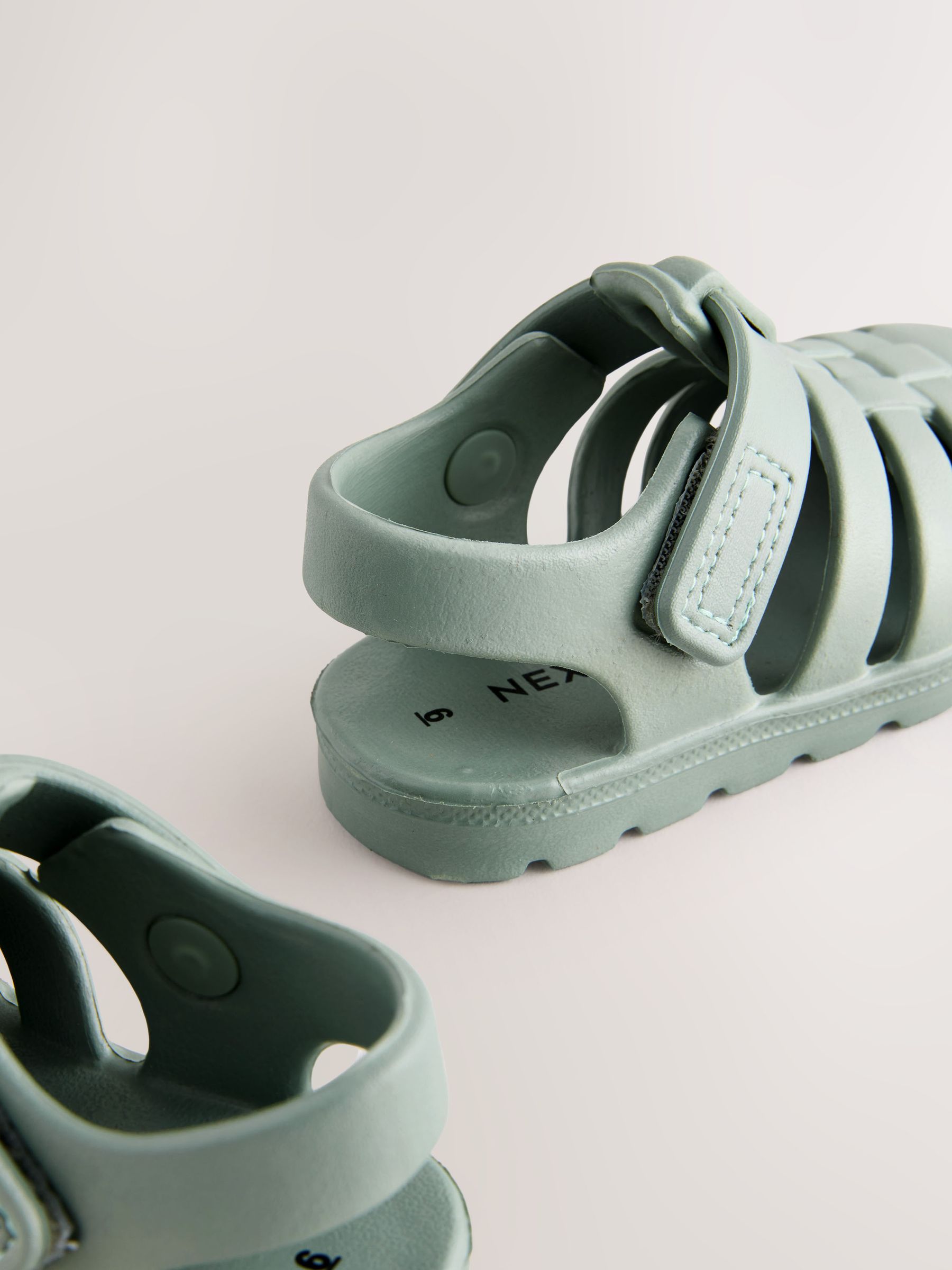 Possession Sandal in Light Green for Kids | Mini Melissa Shoes US NEW MINI MELISSA Kid US 6/6.5 Aranha Green Pearlescent Seashell Fisherman Sandal main image 1