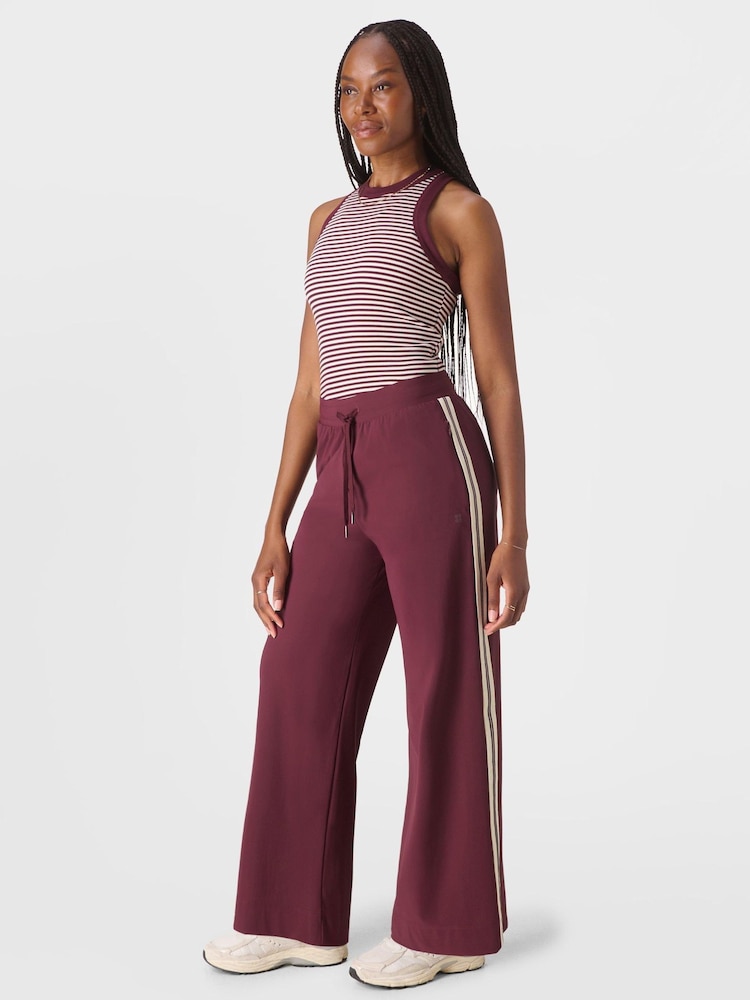 Sweaty Betty Red 32 inch inside seam Explorer Side Stripe Wide Leg 32" Trousers - Image 1 of 7 Sweaty Betty Red 32 inch inside seam Explorer Side Stripe Wide Leg 32" Trousers - Image 1 of 7