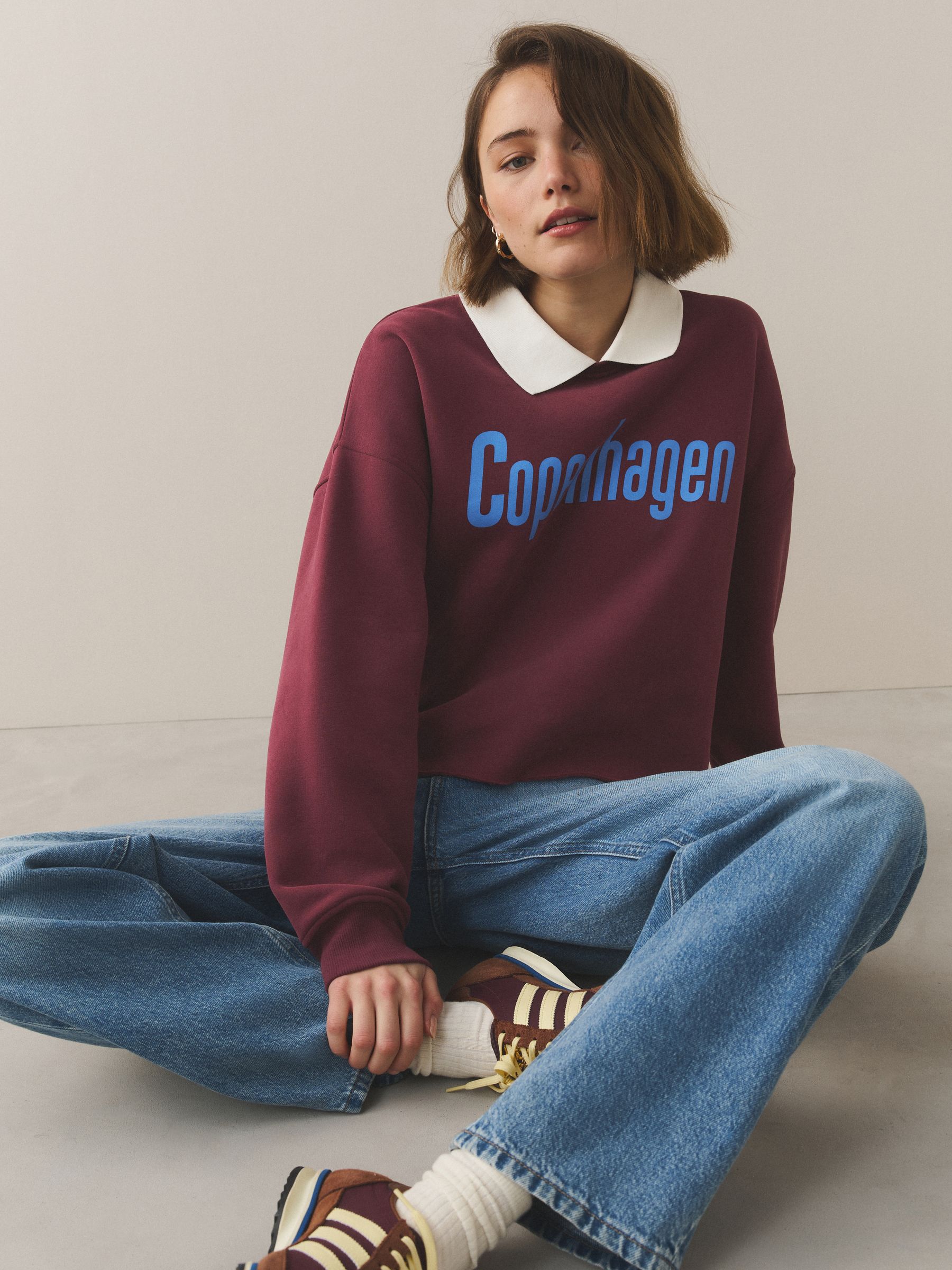 Buy Burgundy Red Collared Graphic Sweatshirt from the Next UK