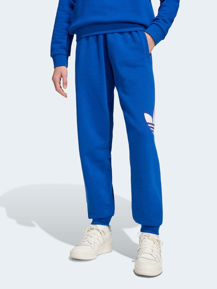 adidas Originals Blue Oversized Trefoil Joggers - Image 1 of 6 adidas Originals Blue Oversized Trefoil Joggers - Image 1 of 6