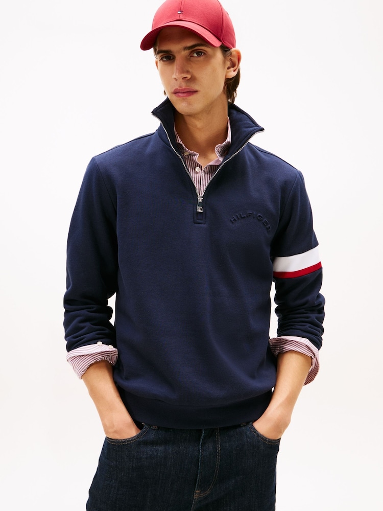 Tommy Hilfiger Blue Quarter-Zip Embossed Logo Jumper - Image 1 of 5 Tommy Hilfiger Blue Quarter-Zip Embossed Logo Jumper - Image 1 of 5