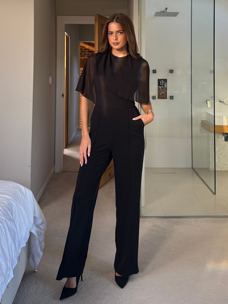 Girl In Mind Black Vivienne Cape Detail Stretch Jumpsuit - Image 1 of 4 Girl In Mind Black Vivienne Cape Detail Stretch Jumpsuit - Image 1 of 4