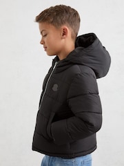 Reiss Black Myles 3-9 yrs Monogram Hooded Relaxed Puffer Jacket - Image 1 of 4