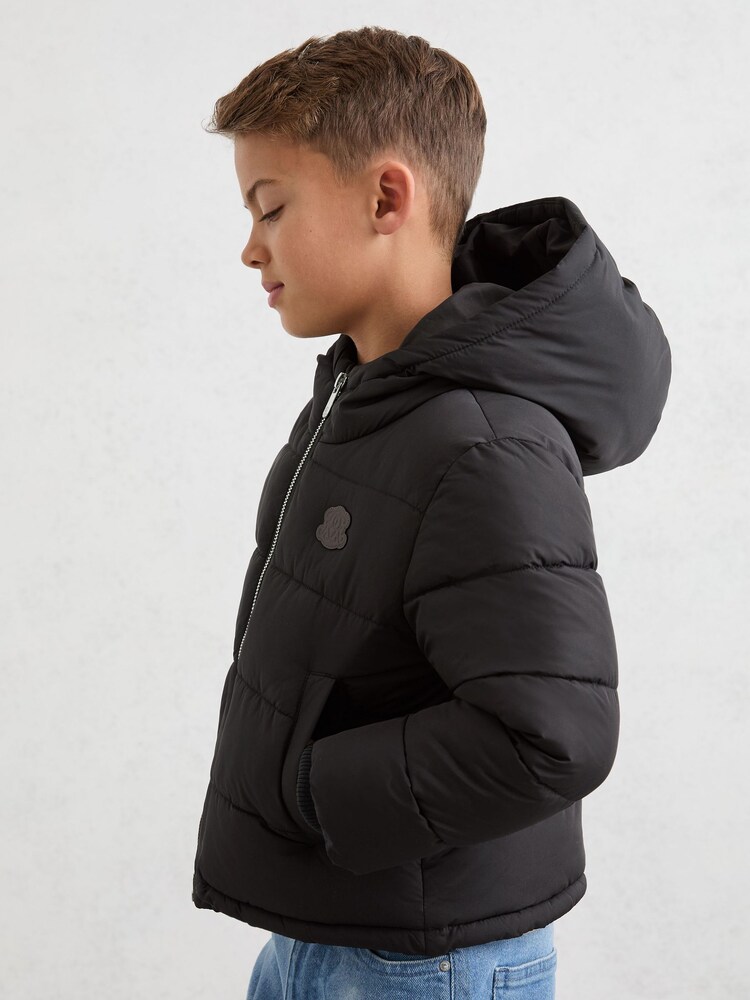 Reiss Black Myles 13-14 yrs Monogram Hooded Relaxed Puffer Jacket - Image 2 of 4 Reiss Black Myles 13-14 yrs Monogram Hooded Relaxed Puffer Jacket - Image 2 of 4