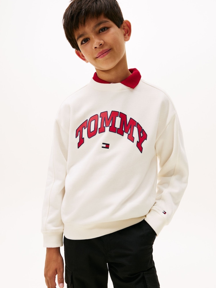 Tommy Hilfiger White Varsity Logo Print Crew Neck Sweattop - Image 1 of 5 Tommy Hilfiger White Varsity Logo Print Crew Neck Sweattop - Image 1 of 5