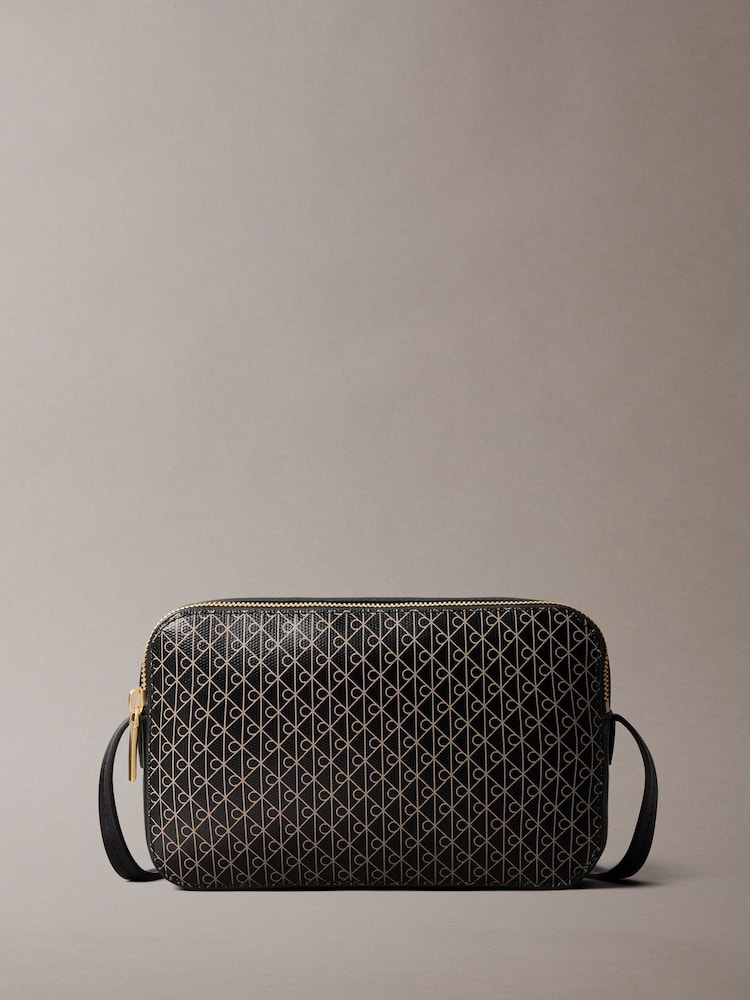 Calvin Klein Black Allover Monogram Logo Camera Bag - Image 1 of 4 Calvin Klein Black Allover Monogram Logo Camera Bag - Image 1 of 4