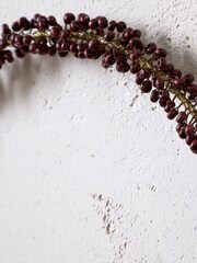 Nkuku Brass and Ruby Tanu Mango Wood Beaded Christmas Wreath - Image 2 of 3
