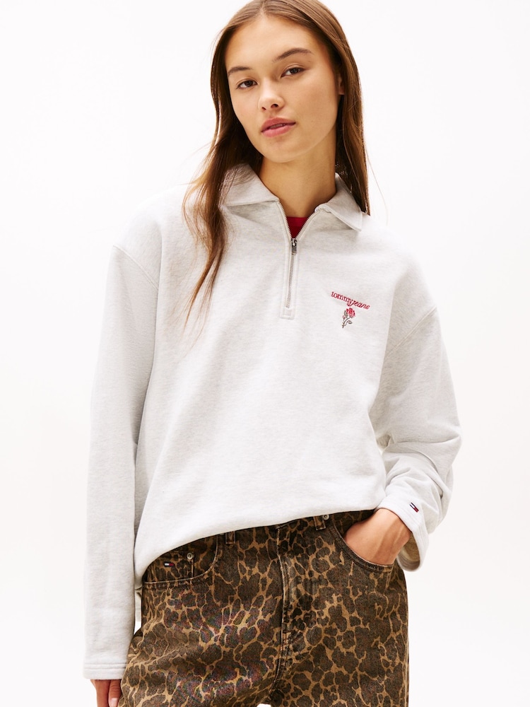 Tommy Jeans White Back Graphic Quarter-Zip Boxy Rugby Jumper - Image 1 of 5 Tommy Jeans White Back Graphic Quarter-Zip Boxy Rugby Jumper - Image 1 of 5