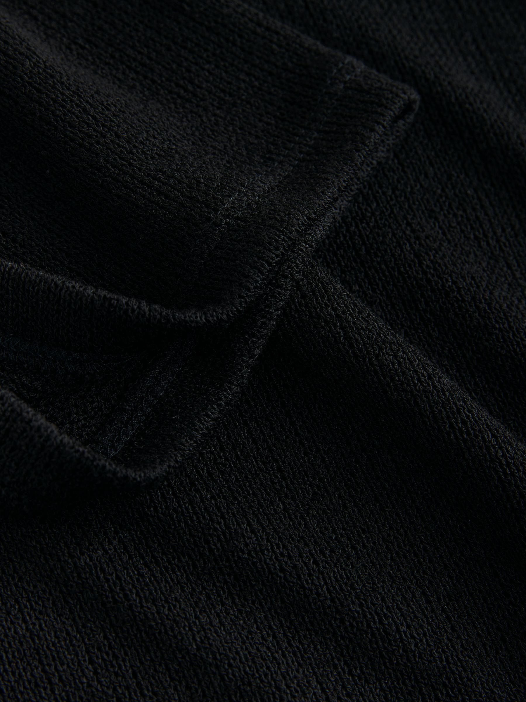 Buy Black Knit Look Asymmetric Short Sleeve Top from the Next UK