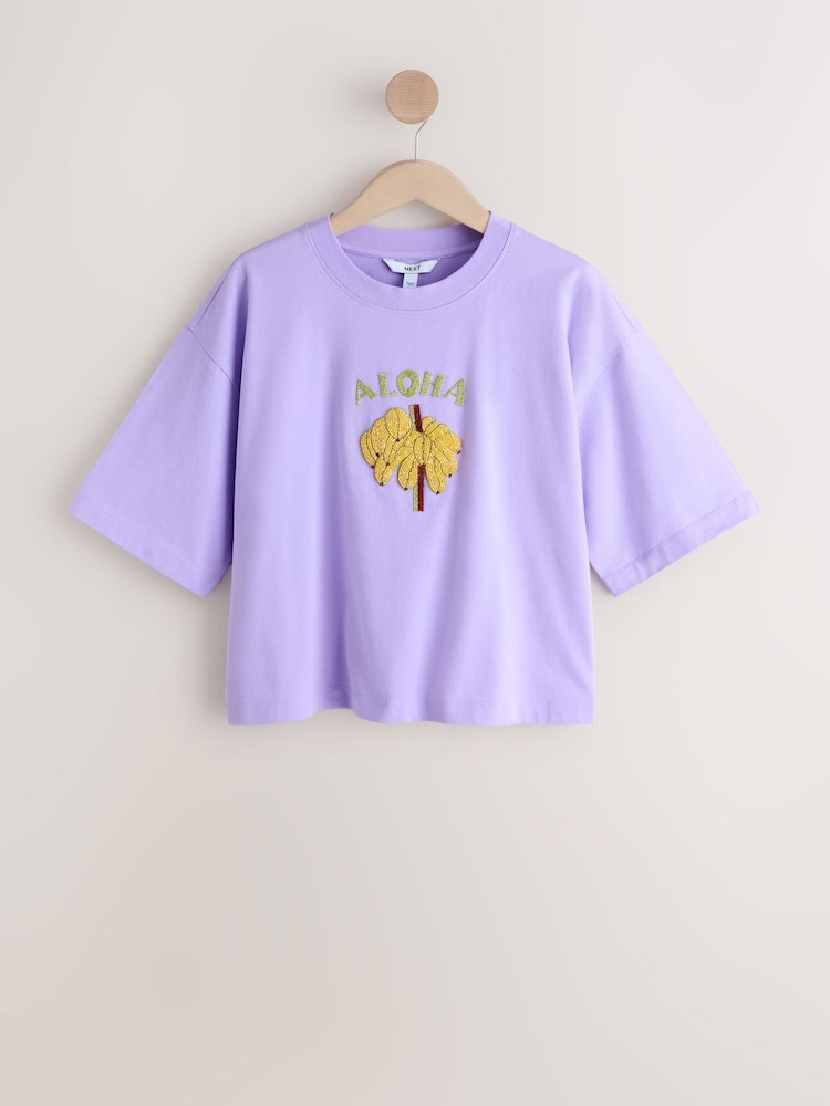 Purple Aloha Sparkle Short Sleeve Crew Neck T-Shirt - Image 1 of 3 Purple Aloha Sparkle Short Sleeve Crew Neck T-Shirt - Image 1 of 3