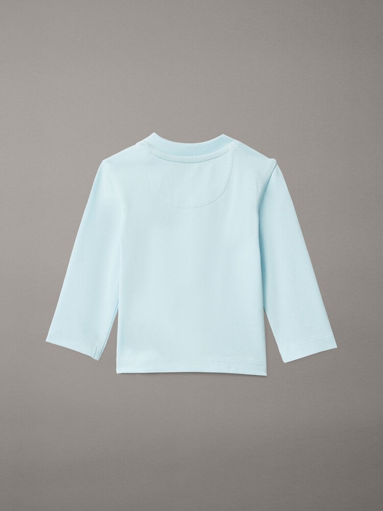 تيشِرت بكُم طويل للمواليد الجُدد من Calvin Klein - صورة 2 من 2 تيشِرت بكُم طويل للمواليد الجُدد من Calvin Klein - صورة 2 من 2