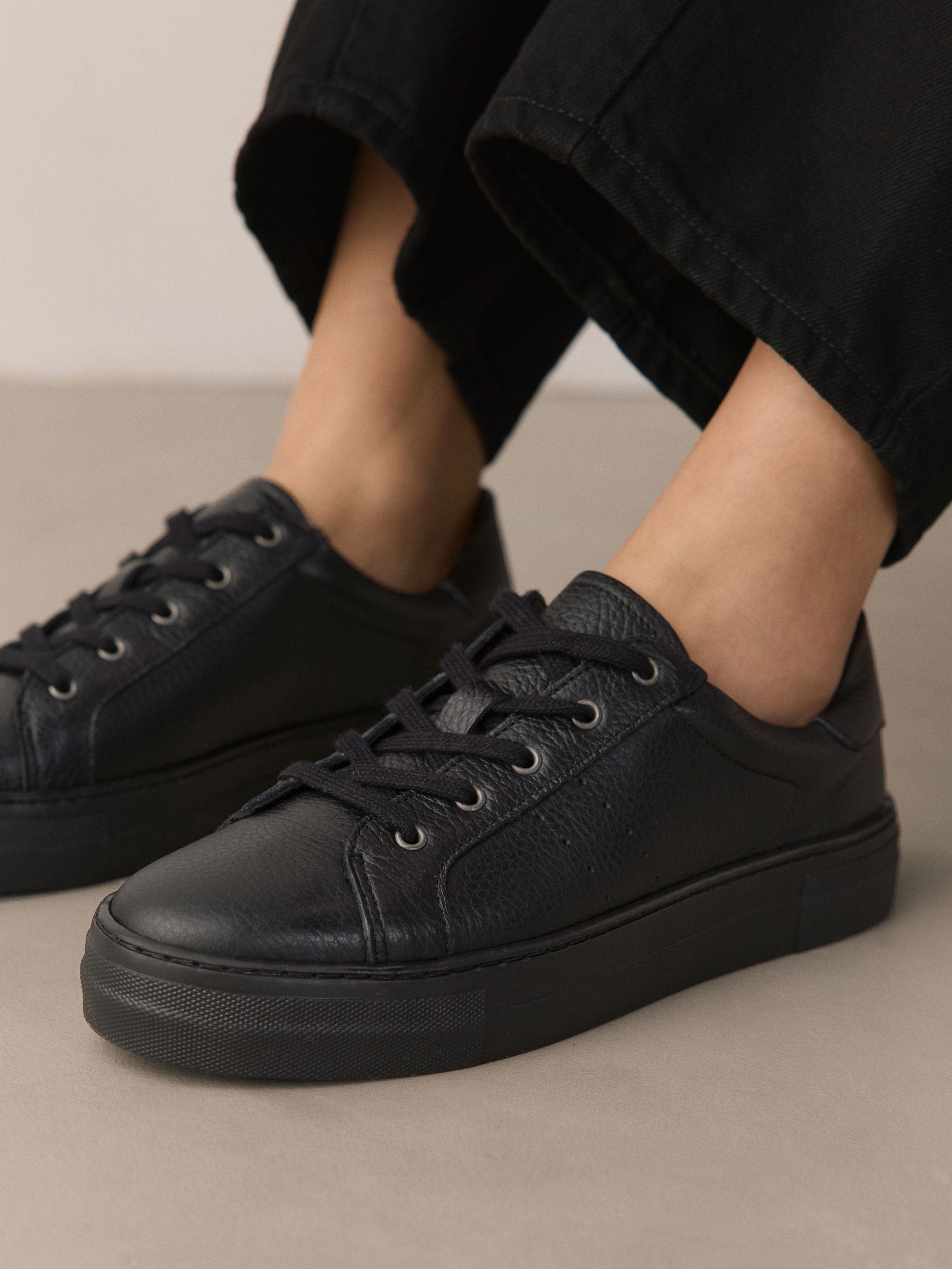 black leather trainer shoes