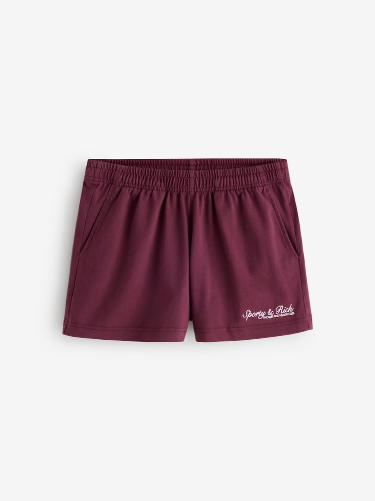 Sporty & Rich Red Syracuse Embroidered Disco Shorts - Image 1 of 5 Sporty & Rich Red Syracuse Embroidered Disco Shorts - Image 1 of 5
