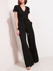 أسود - Friends Like These Short Sleeve Textured Jumpsuit - صورة 1 من 4