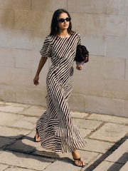 Friends Like These Black/White Stripe Petite Puff Sleeve Tiered Hem Midi Dress - Image 1 of 5