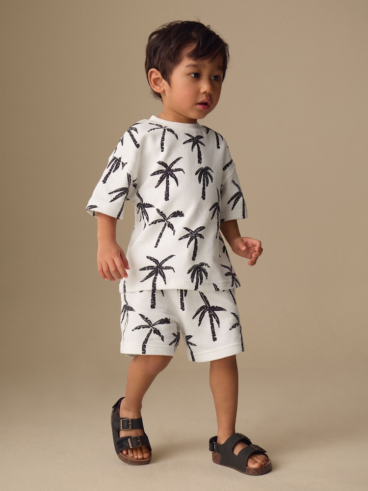 White/Black Palm Trees Short Sleeve All-Over Print T-Shirt and Shorts Set (3mths-7yrs) - Image 1 of 8 White/Black Palm Trees Short Sleeve All-Over Print T-Shirt and Shorts Set (3mths-7yrs) - Image 1 of 8