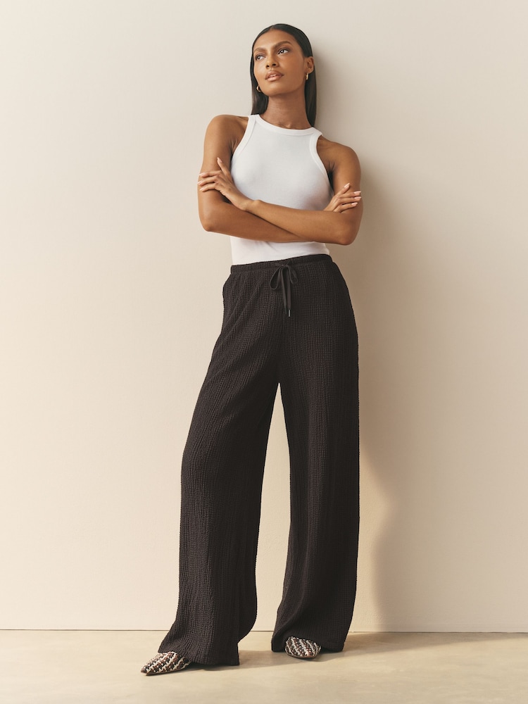 Nothing Ordinary Black Soft Touch Crinkle Jersey Wide Leg Trousers - Image 1 of 2
