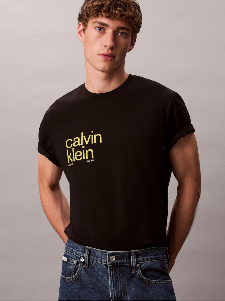 Calvin Klein Black Circle Graphic Relaxed T-Shirt - Image 1 of 6 Calvin Klein Black Circle Graphic Relaxed T-Shirt - Image 1 of 6