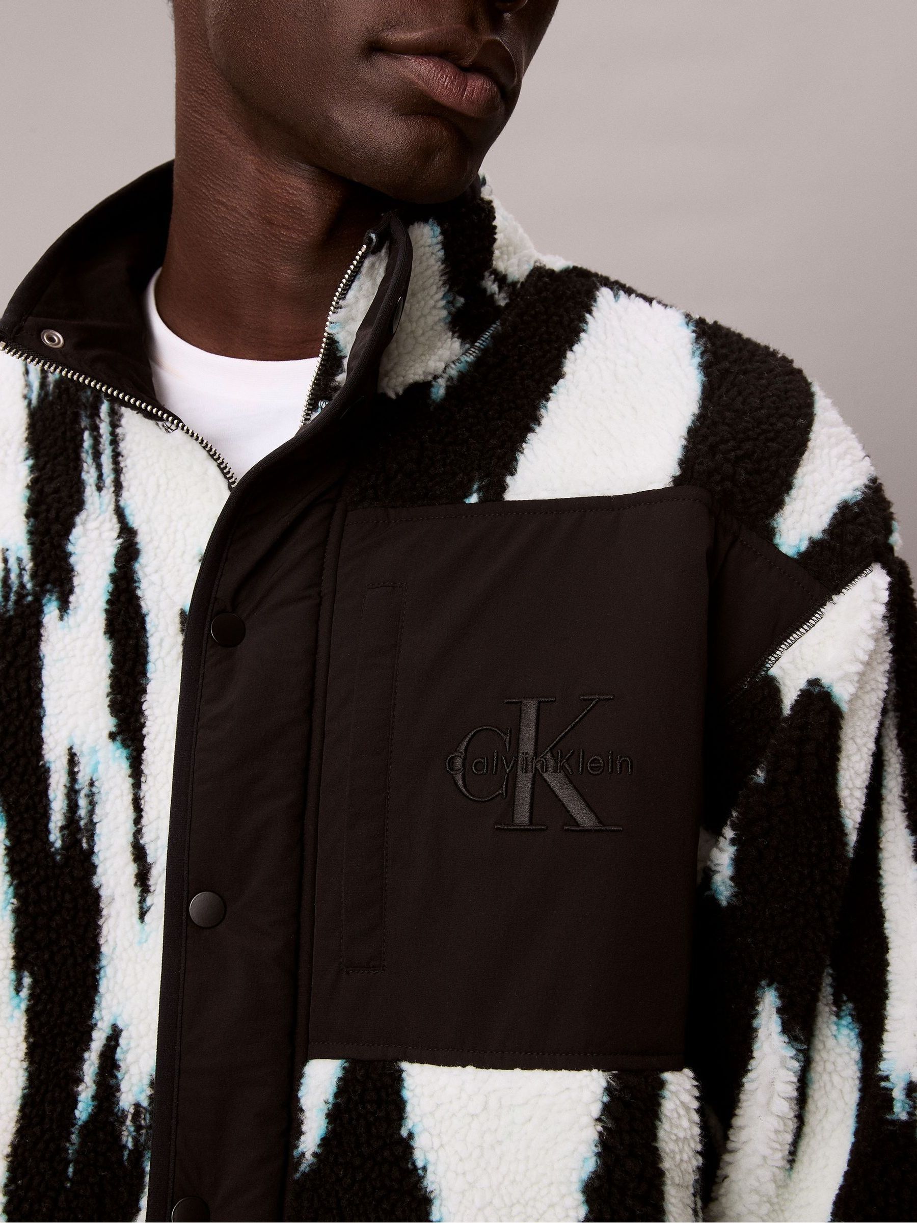 Buy Calvin Klein Black Sherpa Printed Relaxed Mock Neck Jacket Buy Calvin Klein Black Sherpa Printed Relaxed Mock Neck Jacket
