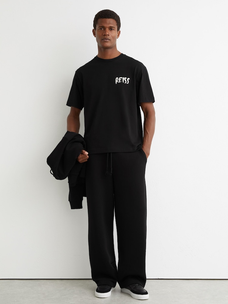 Reiss Black Abbott Cotton Logo-Print Relaxed-Fit T-Shirt - Image 1 of 6 Reiss Black Abbott Cotton Logo-Print Relaxed-Fit T-Shirt - Image 1 of 6