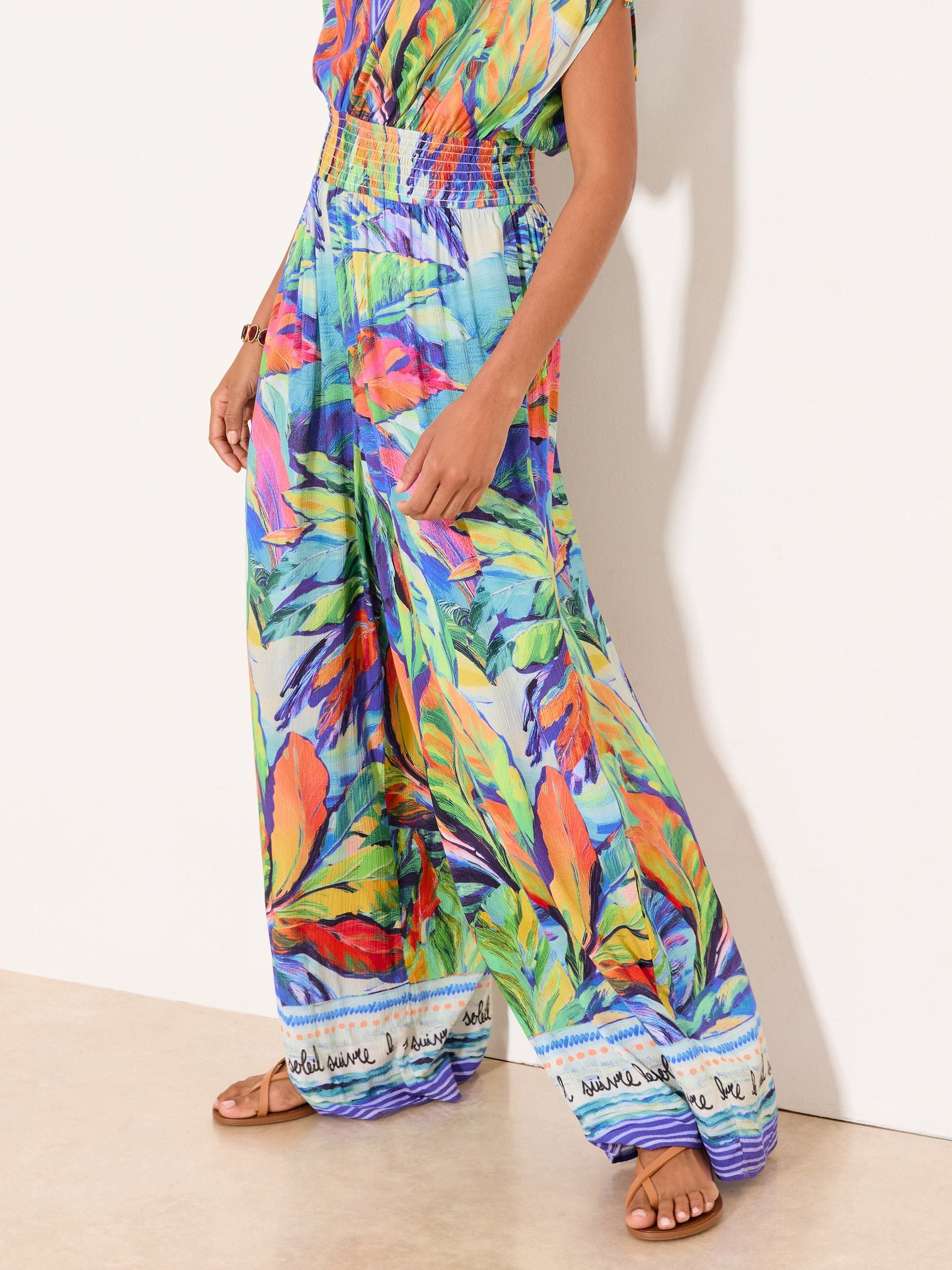 Buy Lipsy Blue Tropical Crinkle Cap Sleeve Jumpsuit from Next Jordan