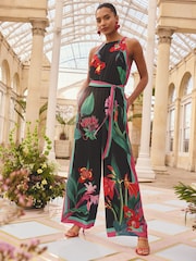 Love & Roses Black Floral Halter Neck Tie Waist Jumpsuit - Image 1 of 4