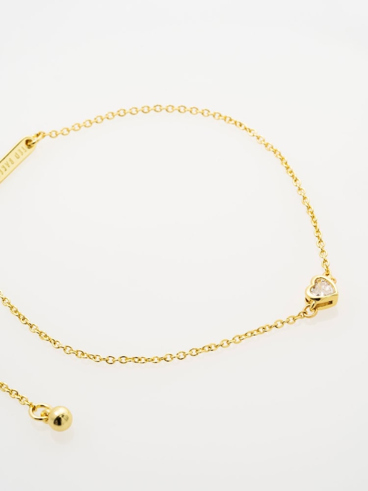 Ted Baker Gold Tone Halle: Mini Crystal Heart Adjustable Bracelet - Image 1 of 4 Ted Baker Gold Tone Halle: Mini Crystal Heart Adjustable Bracelet - Image 1 of 4