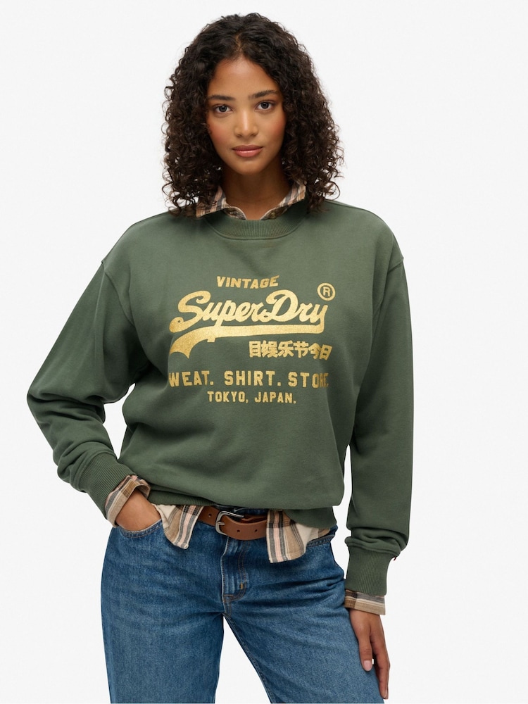 Superdry Green Embellished Vintage Logo Loose Crew Sweattop - Image 1 of 7 Superdry Green Embellished Vintage Logo Loose Crew Sweattop - Image 1 of 7