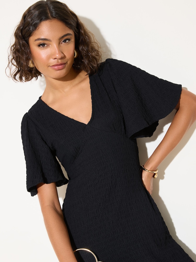 Friends Like These Black Petite Textured Jersey V-Neck Midi Dress - Image 2 of 4 Friends Like These Black Petite Textured Jersey V-Neck Midi Dress - Image 2 of 4