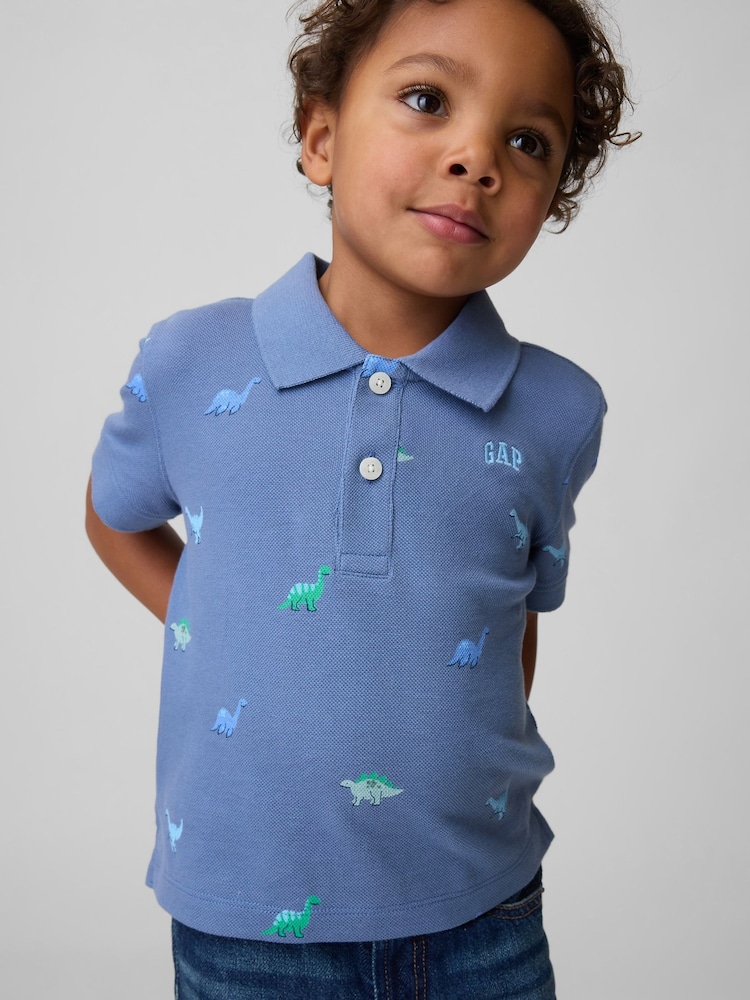 Gap Blue Dinosaur Pique Polo Shirt (6mths-5yrs) - Image 1 of 3 Gap Blue Dinosaur Pique Polo Shirt (6mths-5yrs) - Image 1 of 3