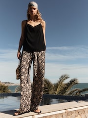 BHOEM Satin Floral Printed Fluid Wide Leg Black/Ecru Trousers - Image 1 of 4
