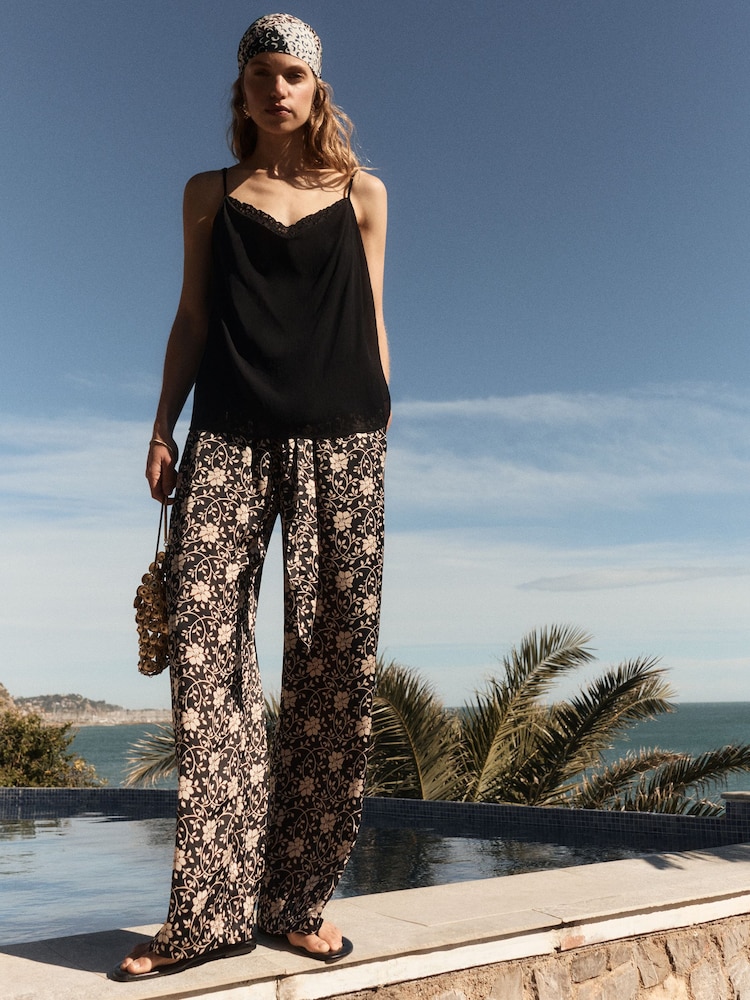 BHOEM Satin Floral Printed Fluid Wide Leg Black/Ecru Trousers - Image 1 of 4