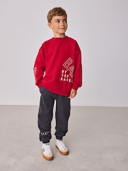 طقم من بنطلون رياضي وسويت شيرت بقصّة واسعة مُزيَّن بطبعة جرافيك من Baker By Ted Baker - Image 1 of 14