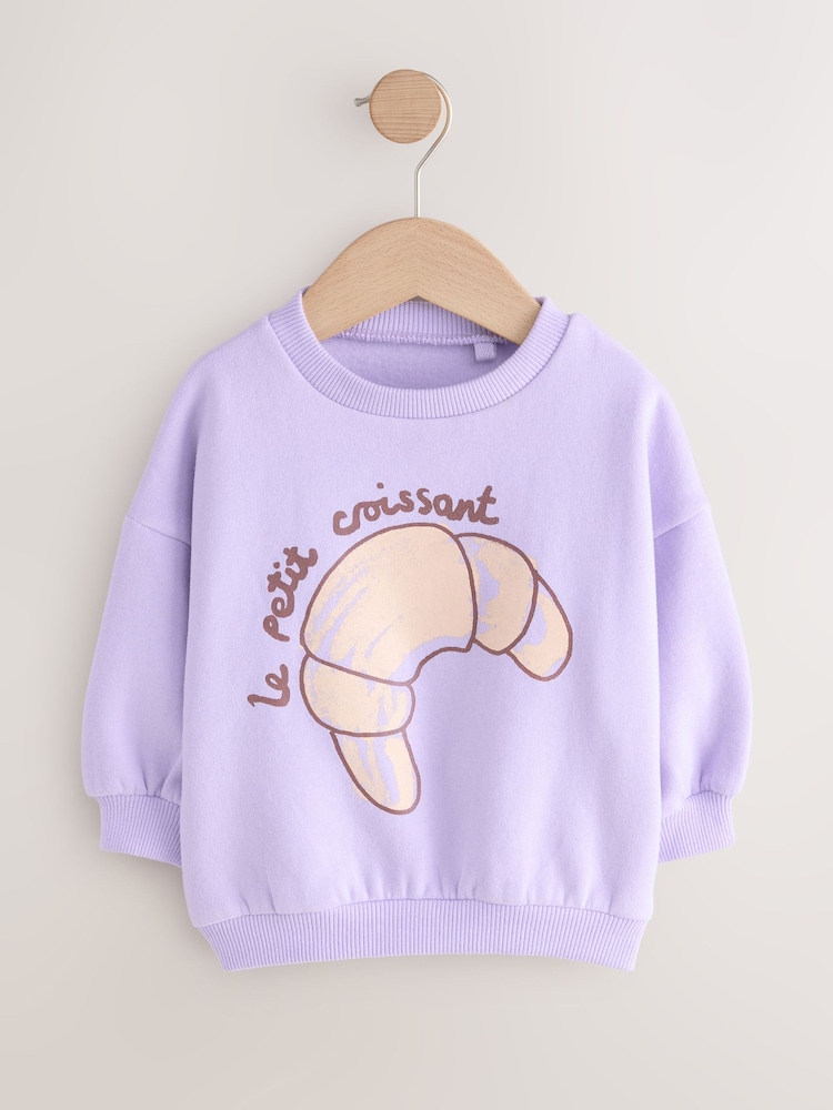 Lilac Purple Crossiant Crew Neck Sweatshirt (3mths-7yrs) - Image 1 of 4 Lilac Purple Crossiant Crew Neck Sweatshirt (3mths-7yrs) - Image 1 of 4