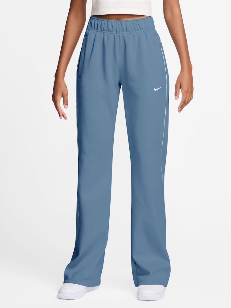 Nike Work Blue Sportswear Windrunner Mid-Rise Slim Knit Joggers - Image 1 of 3 Nike Work Blue Sportswear Windrunner Mid-Rise Slim Knit Joggers - Image 1 of 3