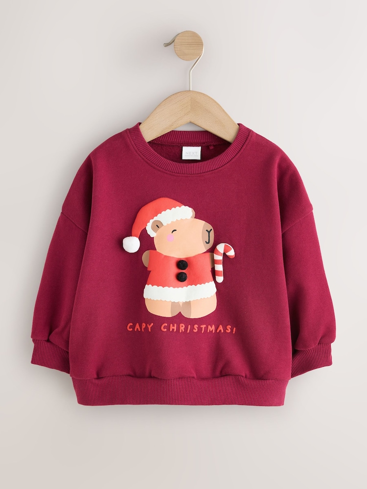Berry Red Christmas Capybara Crew Neck Sweatshirt (3mths-7yrs) - Image 1 of 4 Berry Red Christmas Capybara Crew Neck Sweatshirt (3mths-7yrs) - Image 1 of 4