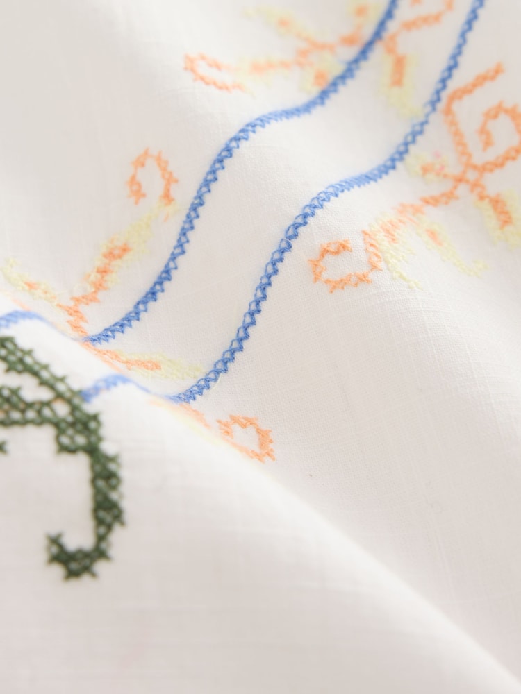 White Floral Embroidered Halter Bow Mini Dress - Image 9 of 9 White Floral Embroidered Halter Bow Mini Dress - Image 9 of 9