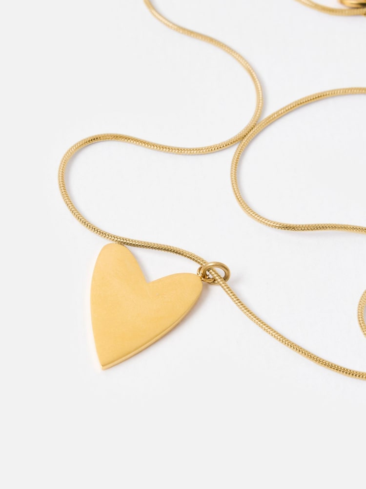 Oliver Bonas Gold Tone Stainless Steel Waterproof Small Heart Pendant Chain Necklace - Image 1 of 6 Oliver Bonas Gold Tone Stainless Steel Waterproof Small Heart Pendant Chain Necklace - Image 1 of 6