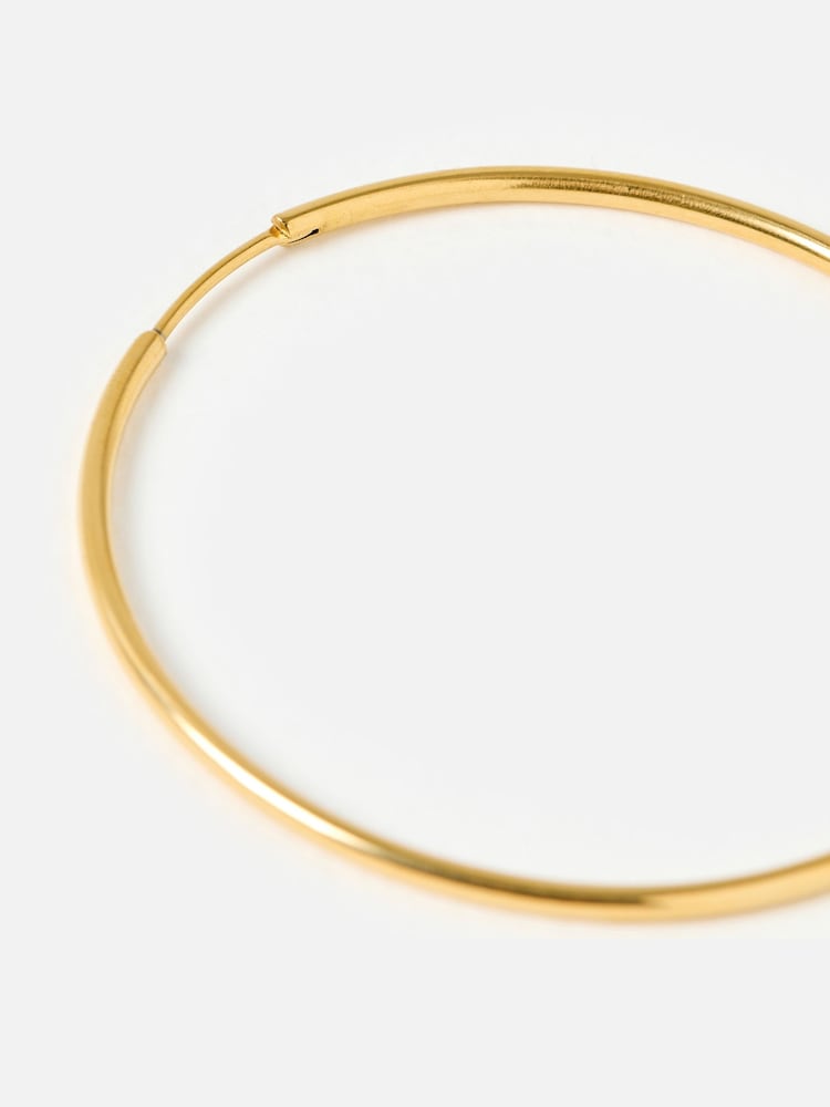 Oliver Bonas Gold Tone Janis Shiny Stainless Steel Waterproof Large Hoop Earrings - Image 3 of 3 Oliver Bonas Gold Tone Janis Shiny Stainless Steel Waterproof Large Hoop Earrings - Image 3 of 3